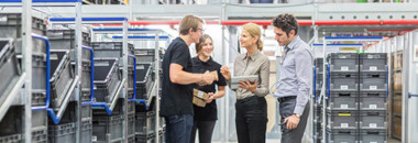 Employees in a sorting manufacturing warehouse