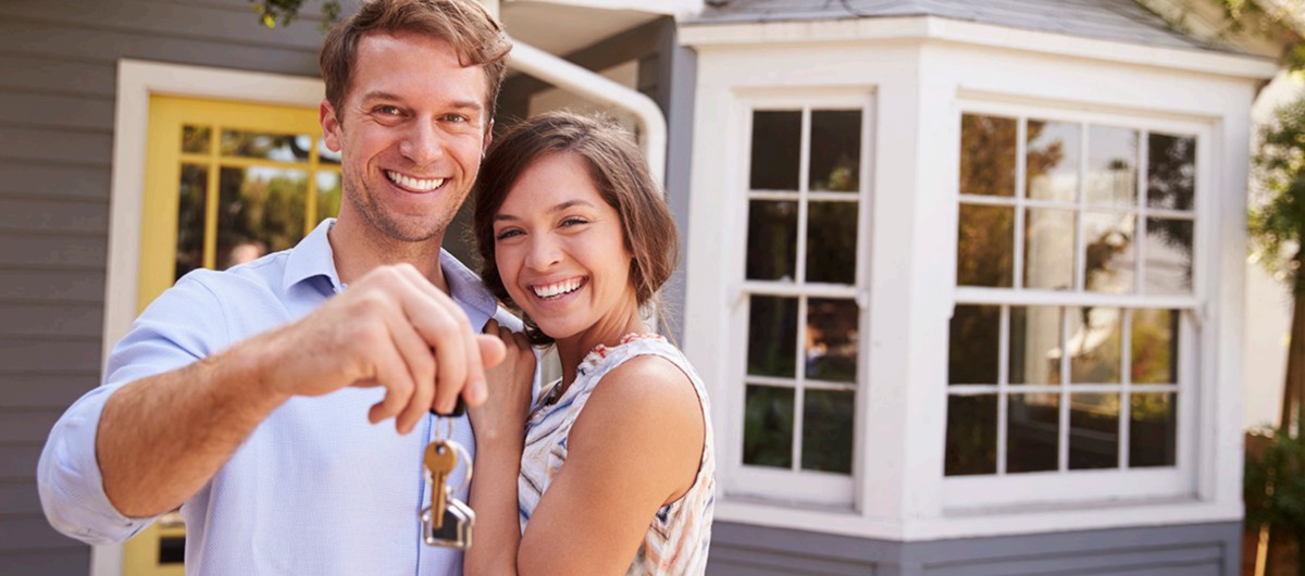 Couple holding keys