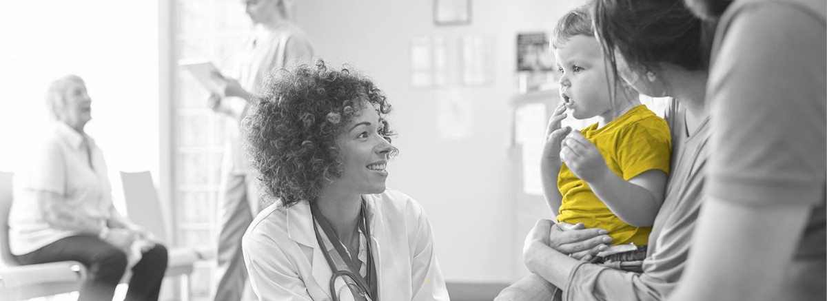 A doctor caring for a child patient